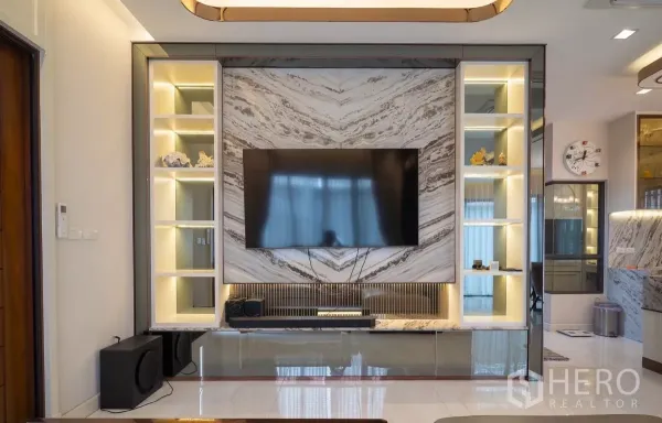 Detached House for rent or sale in Saphan Sung, Bangkok - Living room with marble feature TV wall, back‑lit display shelves and a large flat screen.