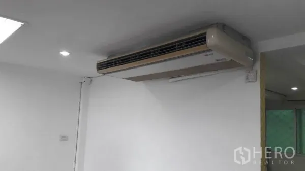 Office Space for rent in Bueng Kum, Bangkok - Wall-mounted split air conditioner on a white office ceiling.