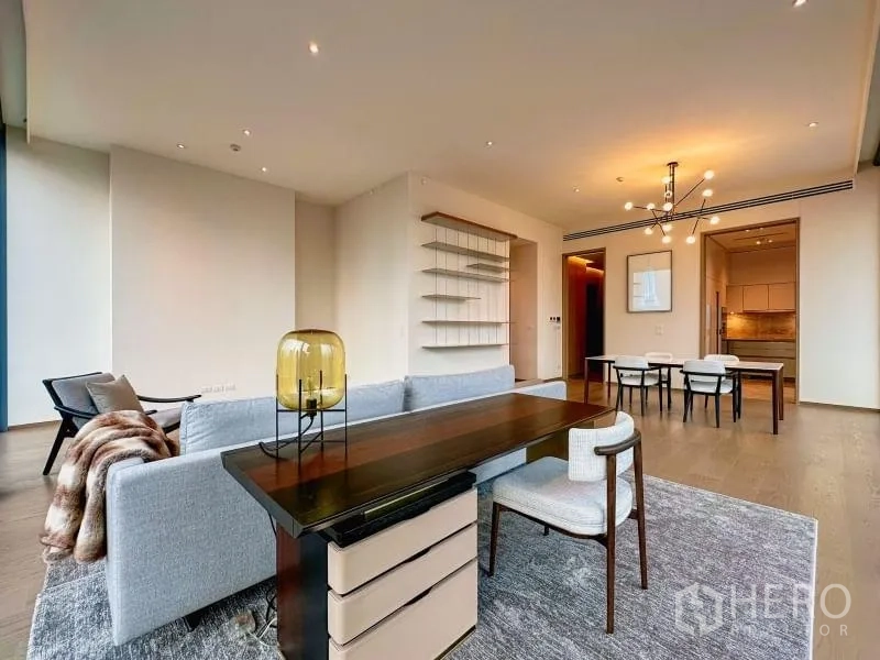 Condominium for rent or sale - Open-plan living and dining with neutral decor and custom shelving.