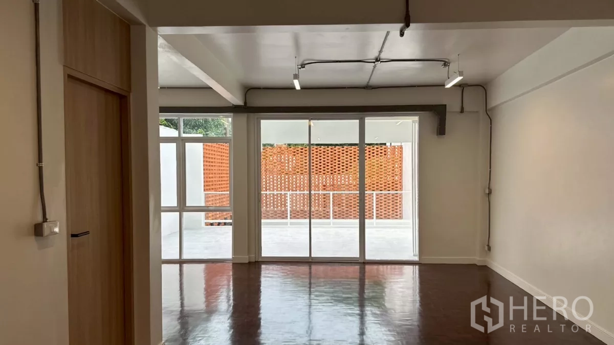 Home Office for rent in Watthana, Bangkok - Second-floor room opening to a large terrace with decorative terracotta screen.