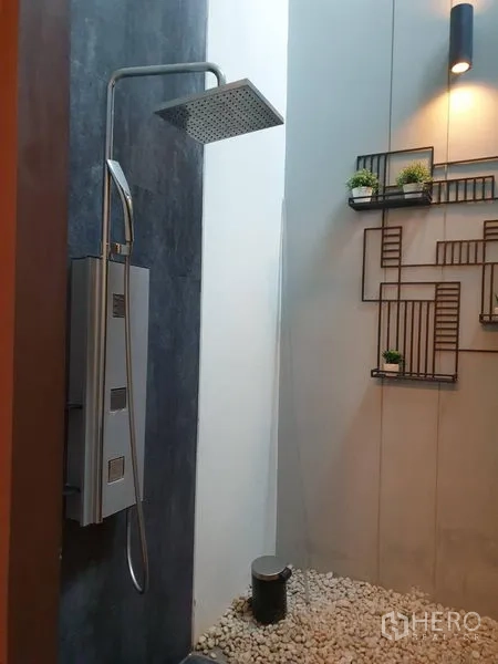 Detached House for sale in Watthana, Bangkok - Outdoor rain shower with stone pebble floor and decorative wall planters.