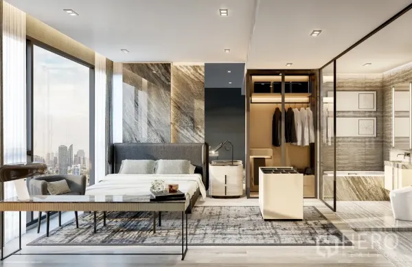 Condominium for sale in Watthana, Bangkok - Bright master bedroom with floor‑to‑ceiling windows, marble feature wall, walk‑in closet and glass-partitioned bathroom with tub.
