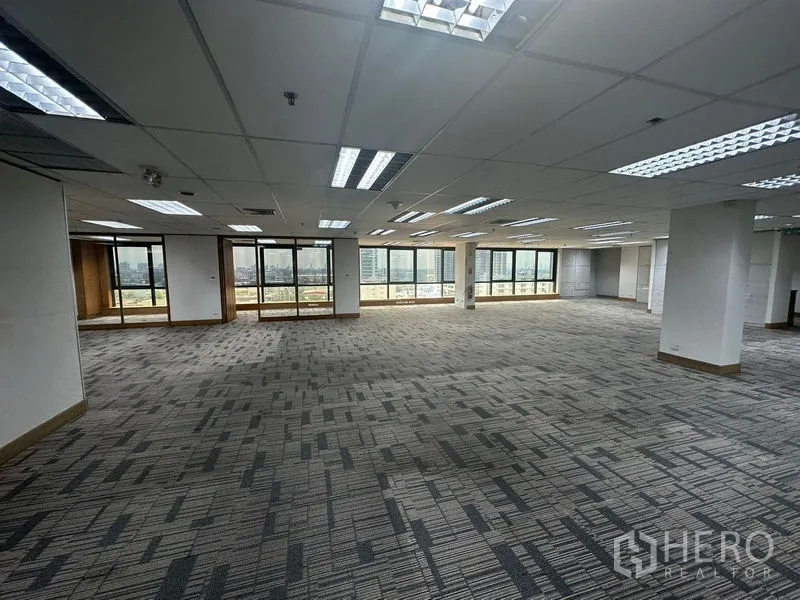 Office Space for rent in Khlong Toei, Bangkok - Open office zone with balcony doors and wide city views.