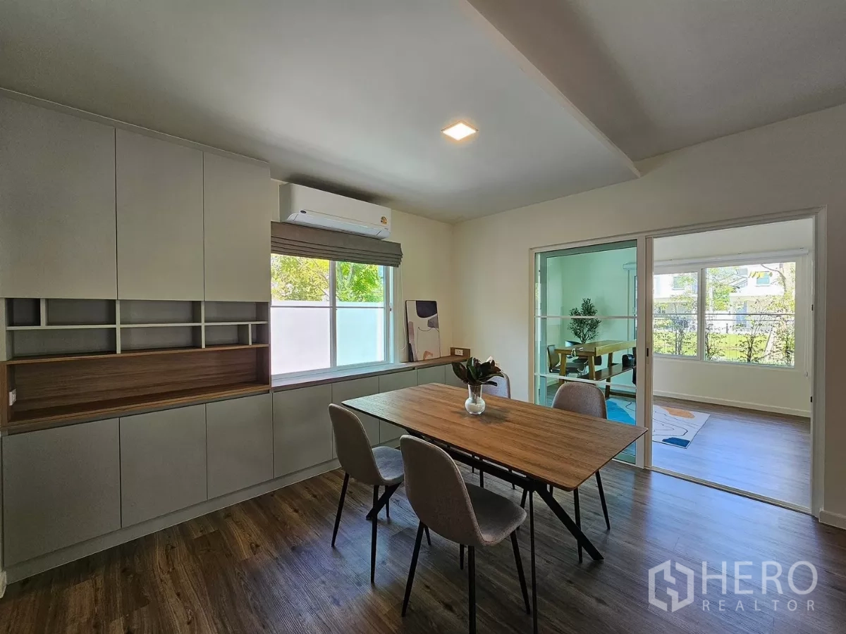 Detached House for rent in Bang Phli, Samut Prakan - Dining area with built-in cabinets and glass partition to study room.