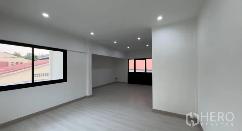 Detached House for rent in Suan Luang, Bangkok - Spacious bedroom with recessed LED lights and wide windows.