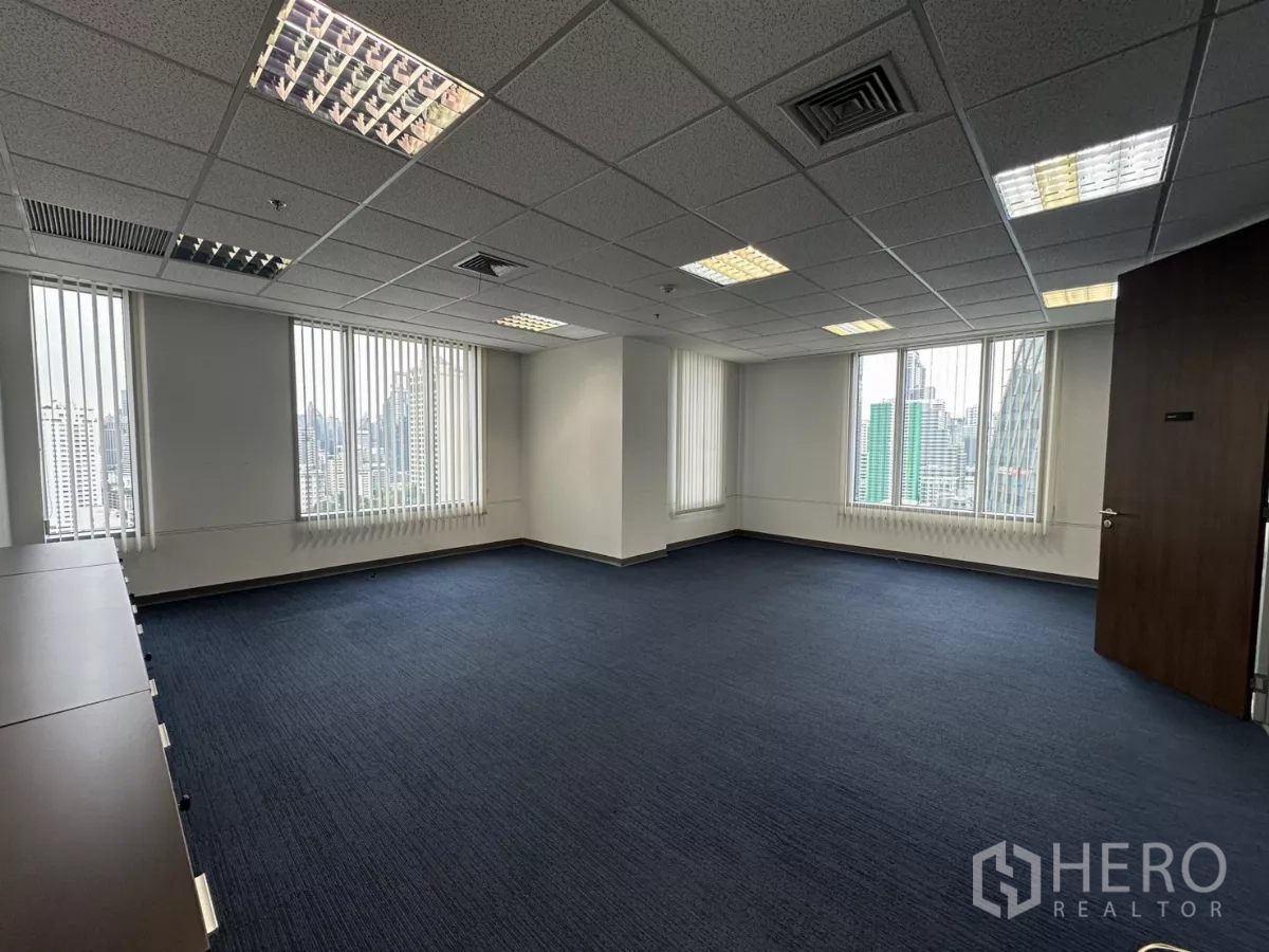 Office Space for rent in Watthana, Bangkok - Large manager’s office or training room with windows on two sides and Bangkok skyline views.