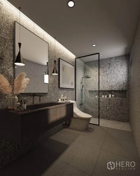 Detached House for rent in Watthana, Bangkok - Contemporary bathroom with terrazzo-style walls, floating vanity, and glass-enclosed shower.