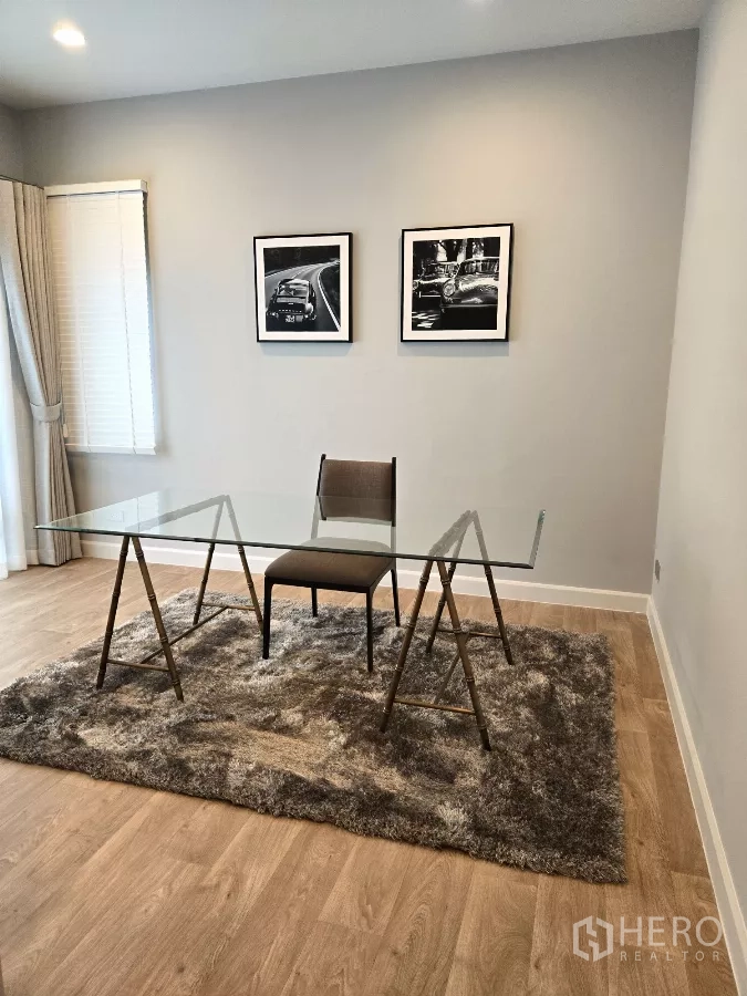 Detached House for rent in Bang Phli, Samut Prakan - Quiet home office with glass desk, rug and framed wall art.