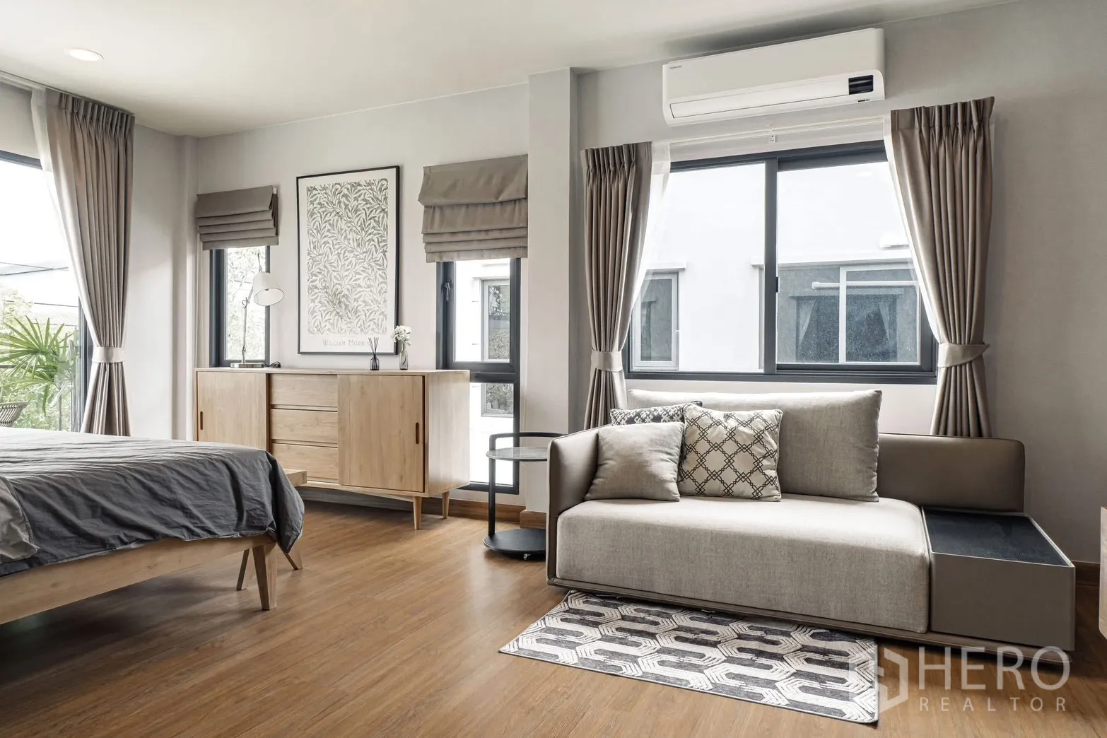 Detached House for rent in Bang Phli, Samut Prakan - Bedroom corner featuring sofa, AC unit, and wide windows with curtains.