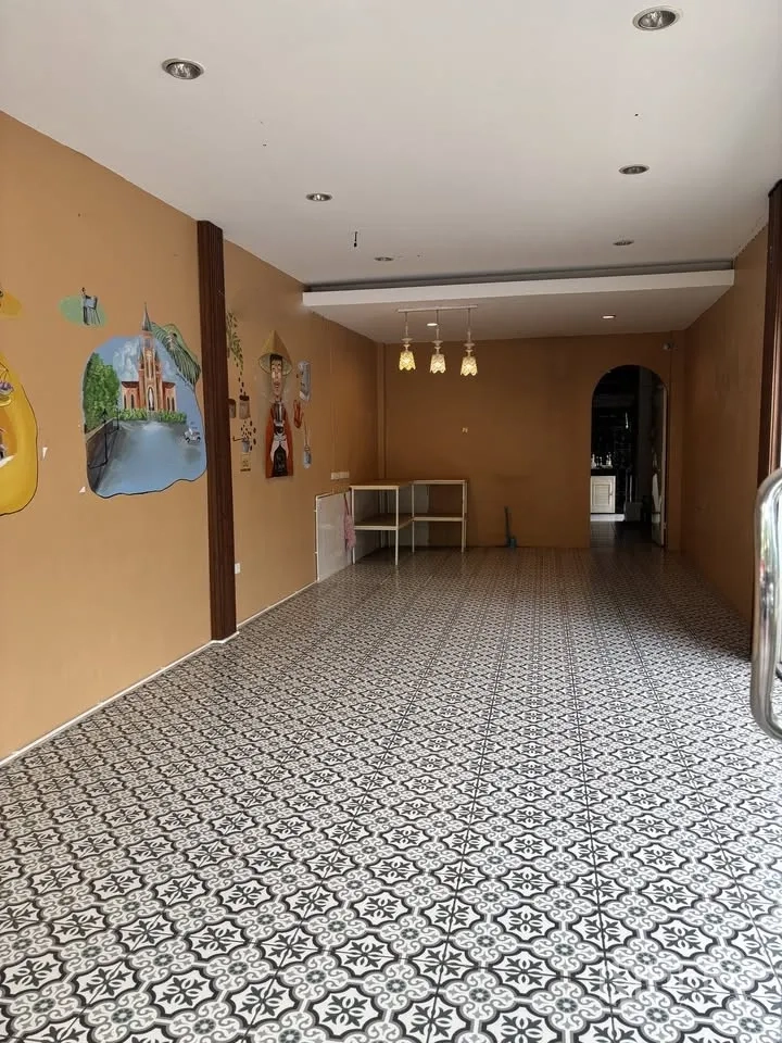 Retail Space for rent in Sathon, Bangkok - Open retail interior with patterned tile flooring and tan walls decorated with murals.