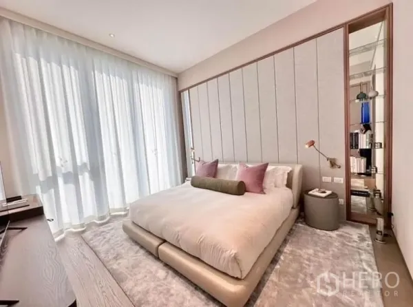 Condominium for rent - Serene master bedroom with padded headboard, plush bed, and soft daylight.