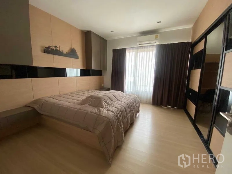 Home Office for rent or sale in Bang Phli, Samut Prakan - Spacious master bedroom with full-height curtains and an air conditioner.