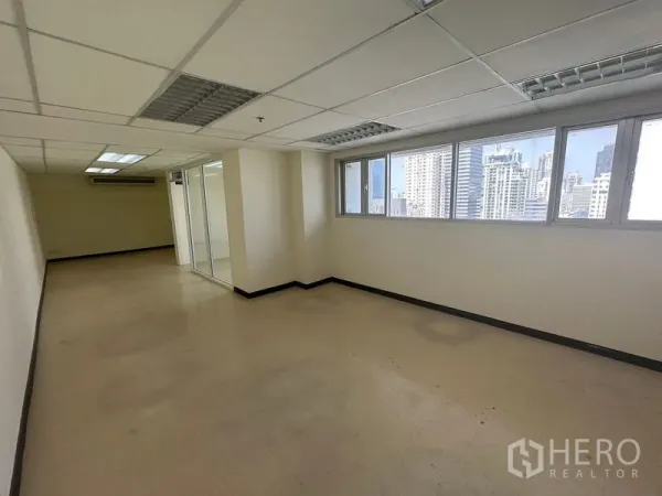 Office Space for rent in Watthana, Bangkok - Bright open office area with wide windows and skyline views near Asok.