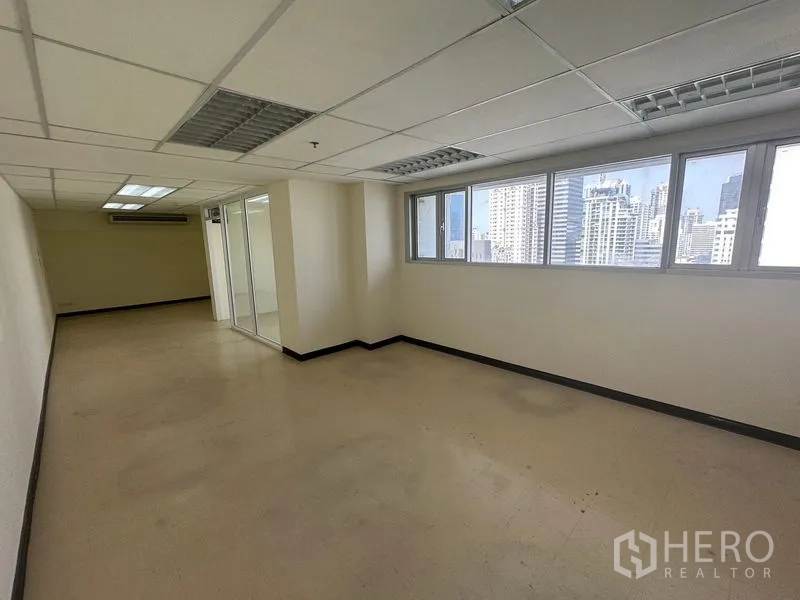 Office Space for rent in Watthana, Bangkok - Bright open office area with wide windows and skyline views near Asok.