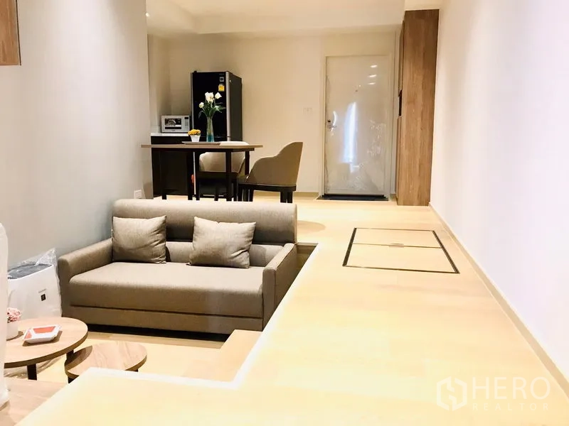 Condominium for rent or sale in Watthana, Bangkok - Split-level layout showing sunken lounge, dining area and floor storage hatches.