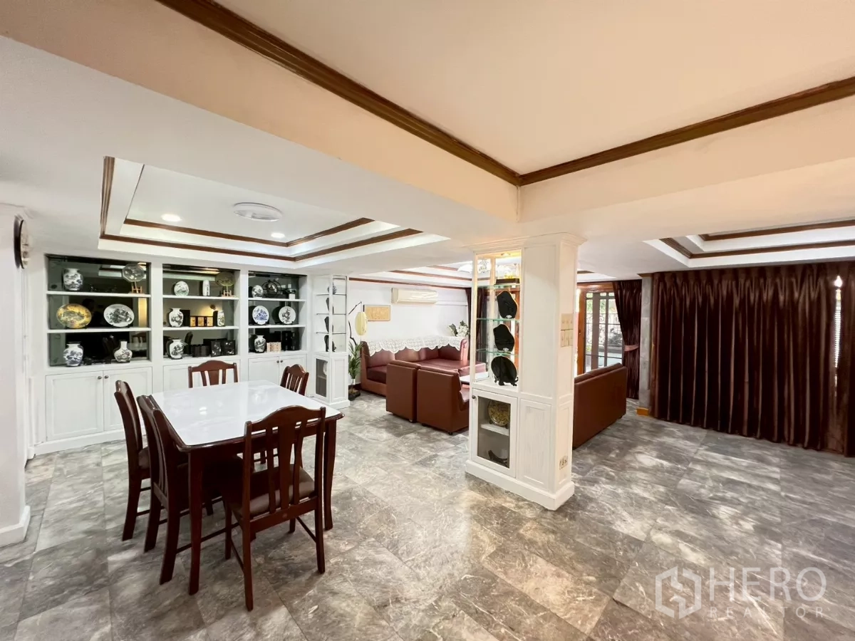 Home Office for rent in Watthana, Bangkok - Open-plan view of dining and lounge with glossy stone-look floors.