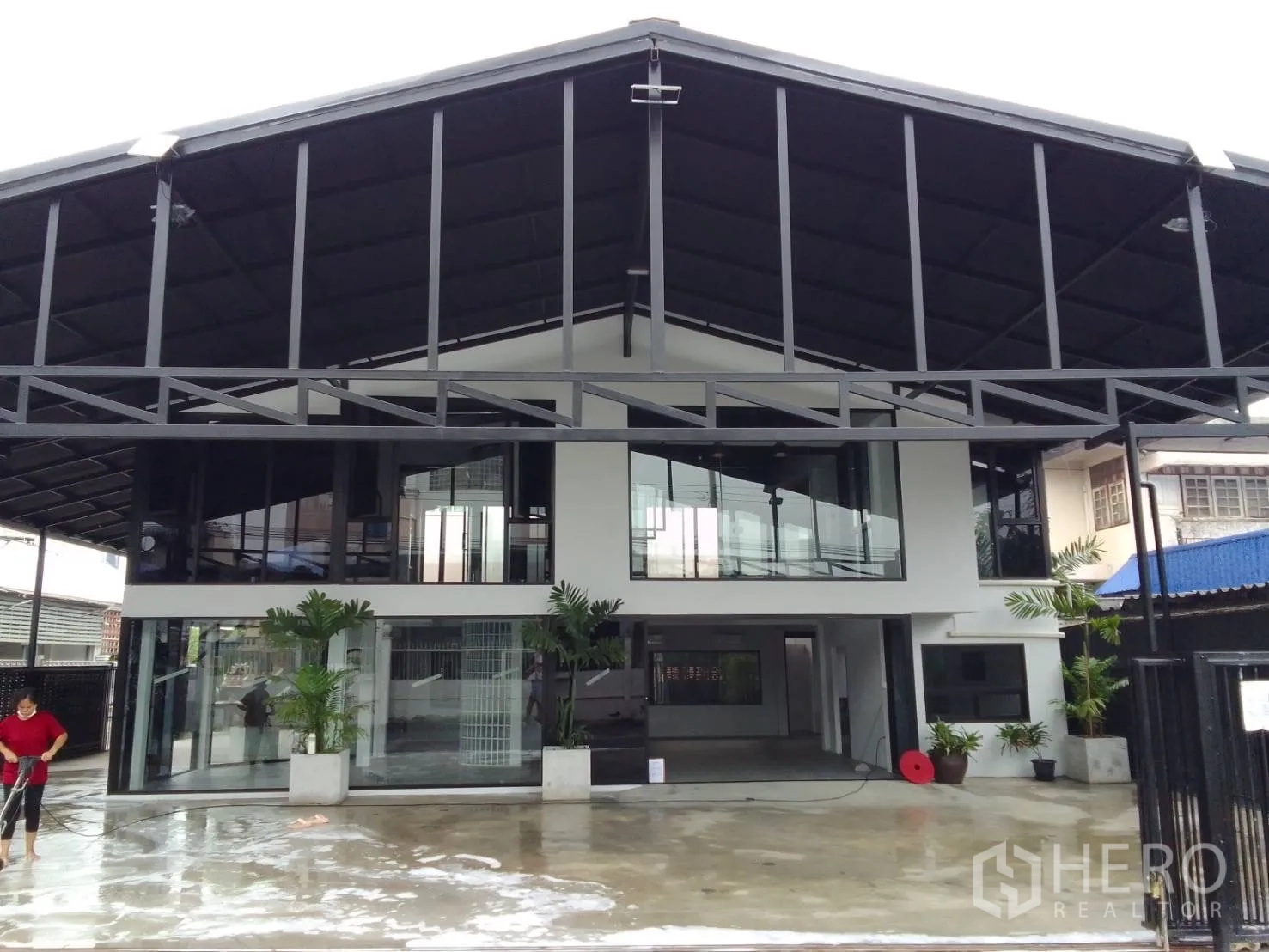Home Office for rent in Wang Thonglang, Bangkok - Front elevation highlighting glass-fronted upper floor beneath a gabled metal roof