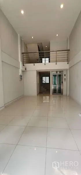 Home Office for rent - Ground floor view toward mezzanine and private elevator in a home office.