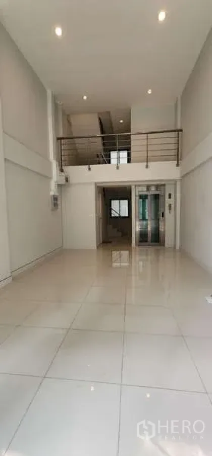 Home Office for rent - Ground floor view toward mezzanine and private elevator in a home office.