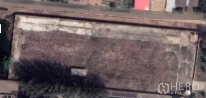 Land for sale in Lam Luk Ka, Pathum Thani - Aerial view of a filled rectangular land plot with clear boundaries and road frontage in Lam Luk Ka, Pathum Thani.