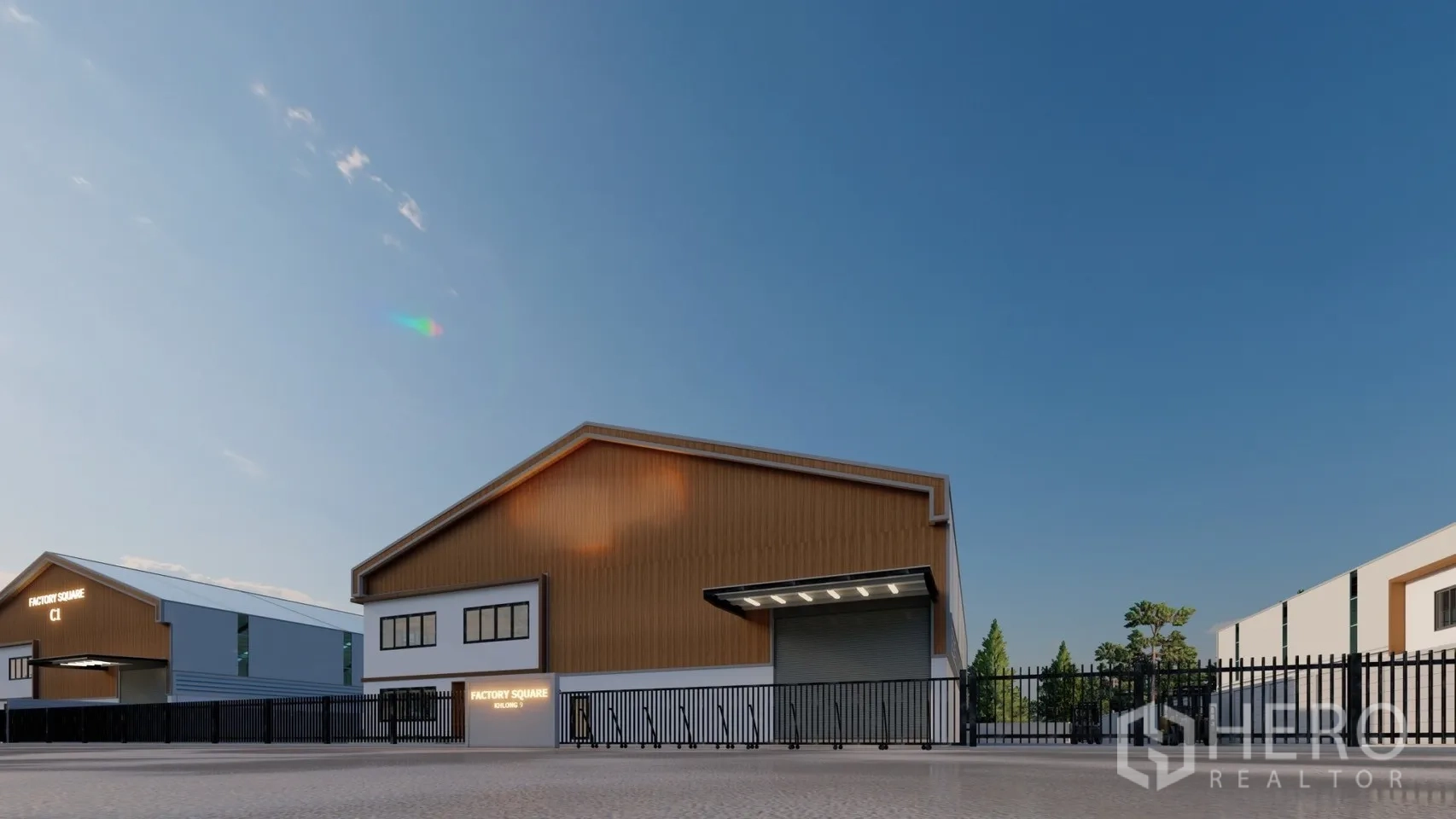 Factory for rent or sale in Lam Luk Ka, Pathum Thani - Gated compound frontage with perimeter fence and factory building beyond.