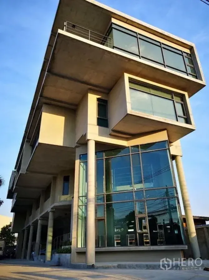 Home Office for rent or sale in Prawet, Bangkok - Modern multi-storey home office in Prawet with cantilevered concrete volumes and floor-to-ceiling glass.