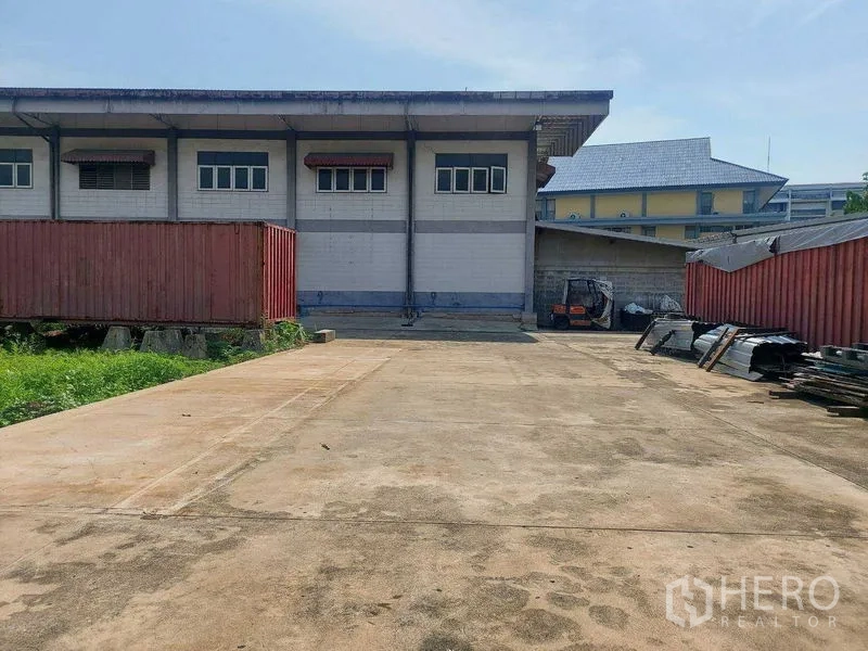 Warehouse for rent in Min Buri, Bangkok - Rear loading zone with broad hardstand, containers and access to the warehouse dock.