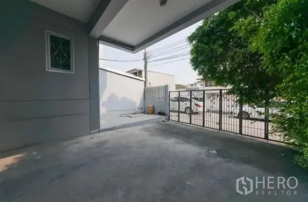 Home Office for rent or sale - Covered carport with gated entrance and paved driveway at the front of the property.