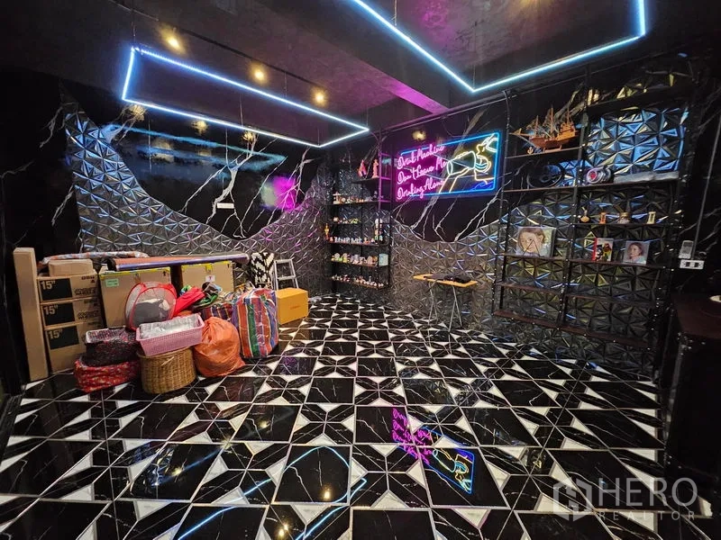 Detached House for sale in Thawi Watthana, Bangkok - Spacious tiled entertainment room with neon lighting and patterned floors.