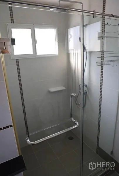 Detached House for rent in Suan Luang, Bangkok - Shower area with glass enclosure and electric water heater.