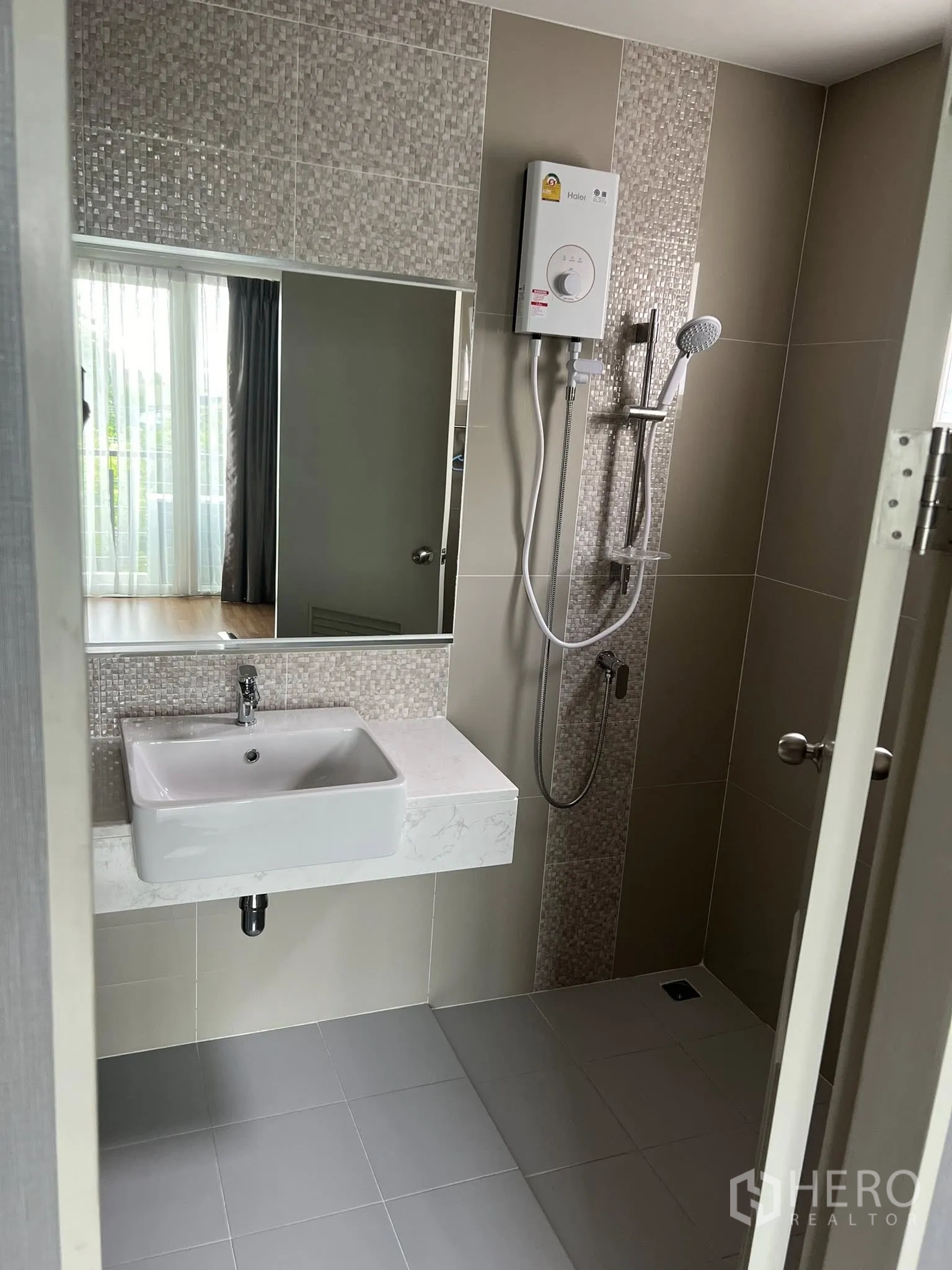 Detached House for rent or sale in Don Mueang, Bangkok - Bathroom with vanity sink, shower and water heater.