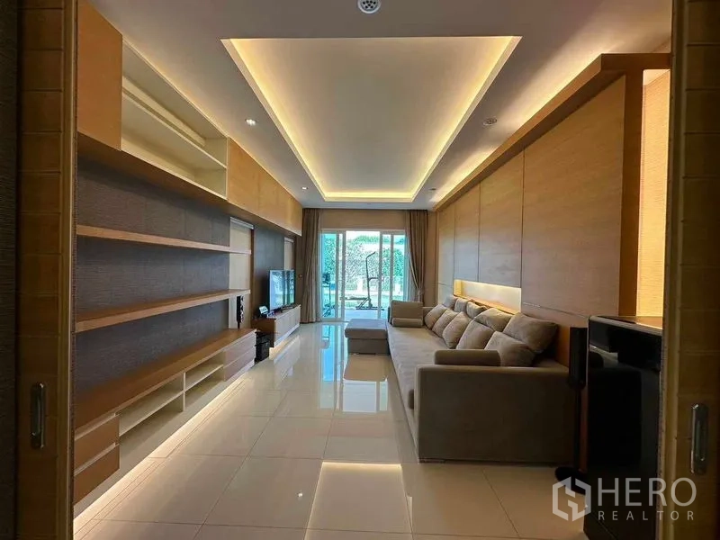 Detached House for rent or sale in Bang Phli, Samut Prakan - Media room with built‑in shelving, LED ceiling and long sofa