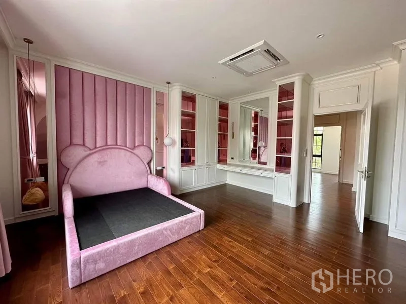 Detached House for sale - Kids’ bedroom with pink upholstered headboard, built-in storage and vanity.