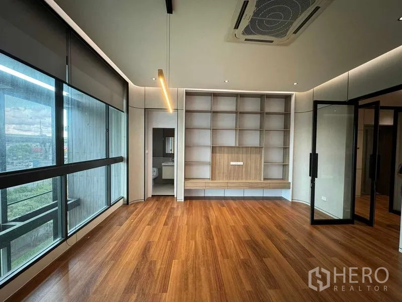 Home Office for rent or sale in Bang Phli, Samut Prakan - Executive office with long window, built‑in shelving and ensuite bathroom.