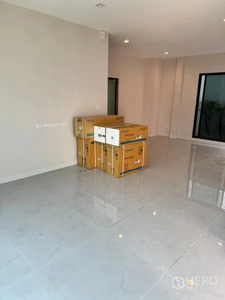 Detached House for rent or sale - Ground-floor room with glossy tile floor and stacked boxes along the wall.
