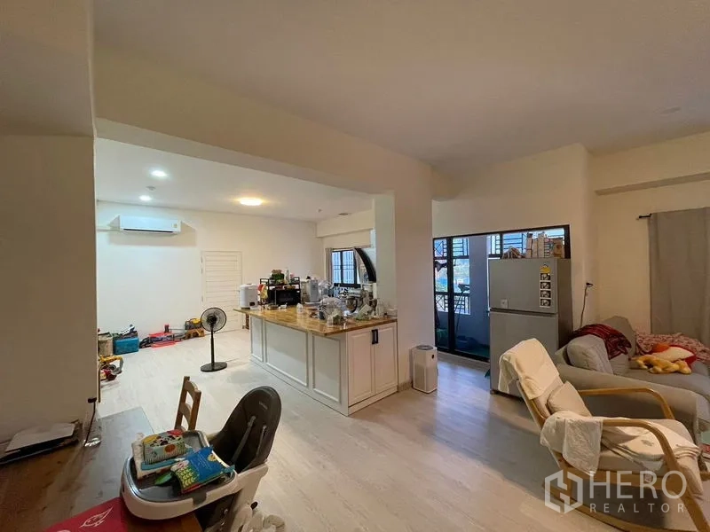 Condominium for sale in Sathon, Bangkok - Open-plan living and dining with a large island kitchen, lounge seating and balcony access.