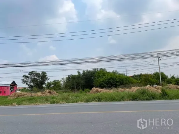 ที่ดิน ขายในLam Luk Ka, Pathum Thani - ที่ดินว่างลำลูกกาติดถนนใหญ่ มีสายไฟฟ้าพาดหน้าแปลง
