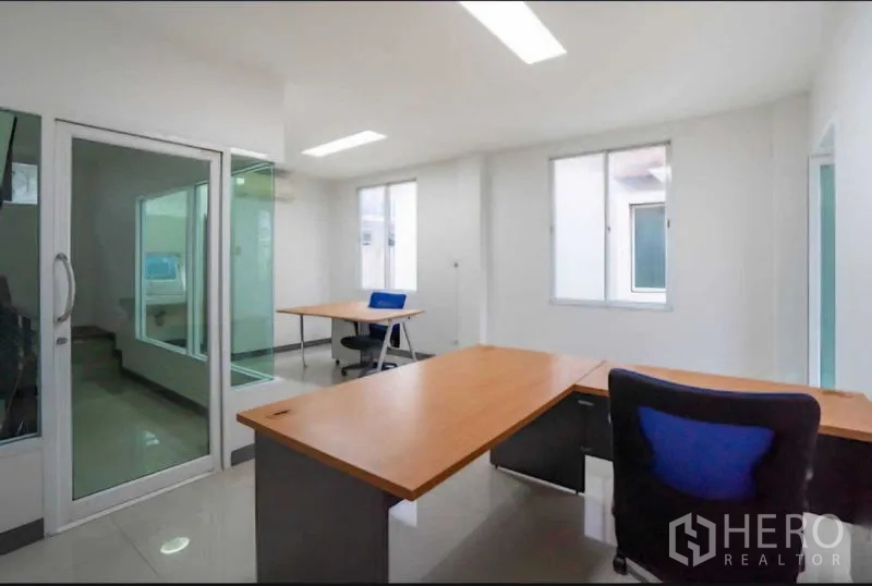 Home Office for rent or sale in Lat Krabang, Bangkok - Open-plan office with multiple desks and glass doors.