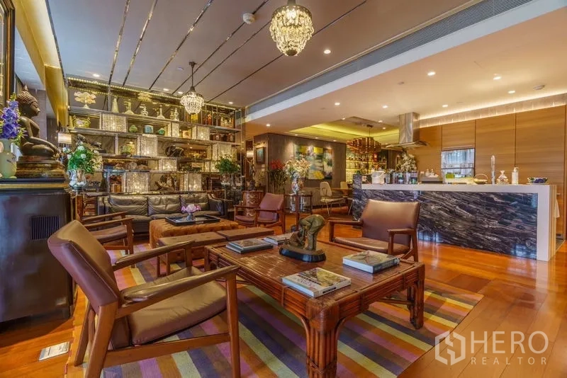 Condominium for sale in Yan Nawa, Bangkok - Spacious living area facing the kitchen and illuminated display shelves.