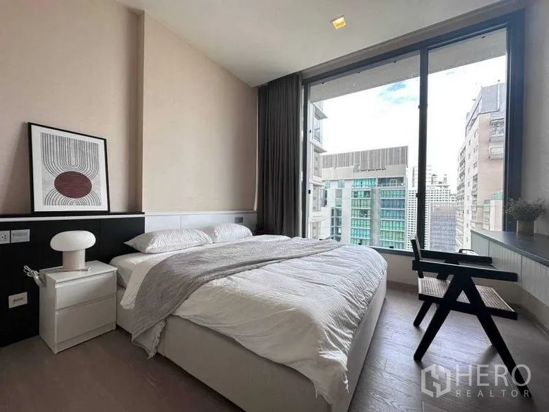 Condominium for rent in Watthana, Bangkok - Bedroom with large window, city view and built-in headboard