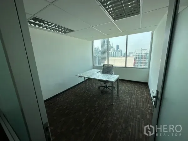 Office Space for rent in Watthana, Bangkok - Private corner office with large window, L-shaped desk and Bangkok skyline view.