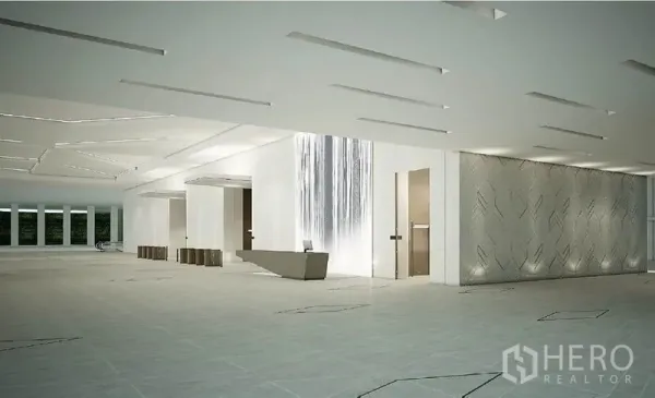 สำนักงาน ให้เช่าในRatchathewi, Bangkok - โถงต้อนรับสไตล์มินิมอล มีผนังน้ำตก เคาน์เตอร์หิน และพื้นกระเบื้องกว้าง