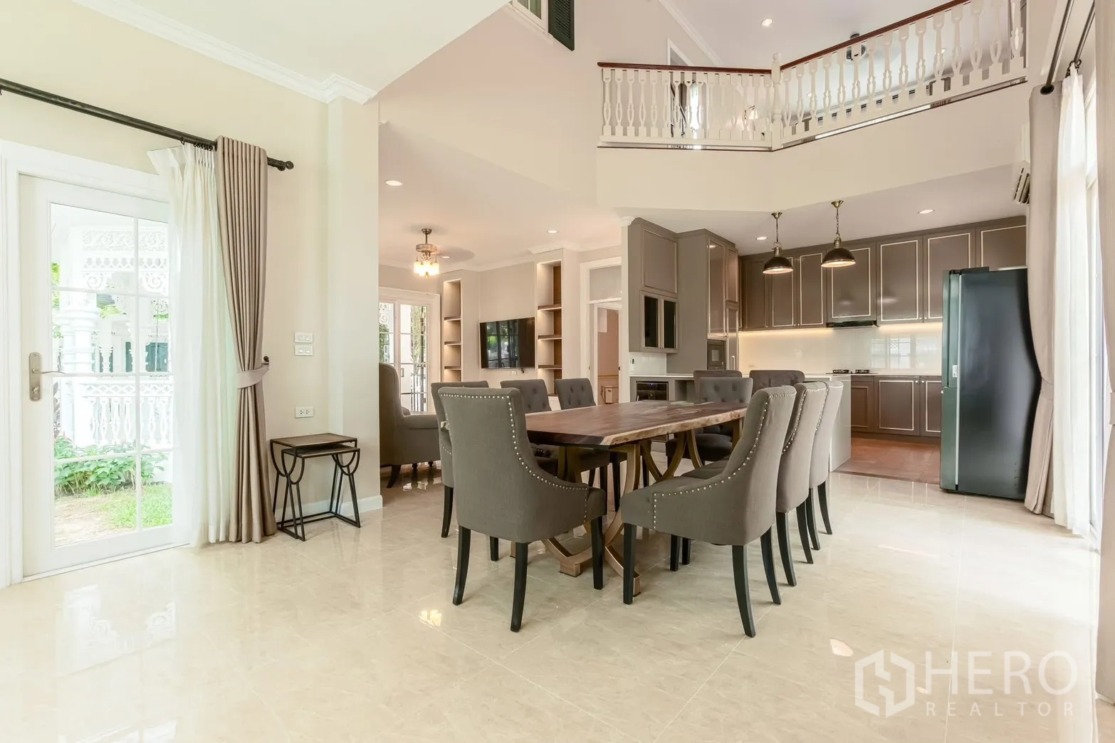 Detached House for rent in Bang Na, Bangkok - Dining area beside the kitchen with French doors and high ceilings.