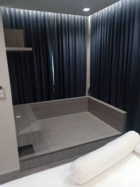 Detached House for rent in Thanyaburi, Pathum Thani - Raised platform daybed beside floor-to-ceiling blackout curtains in a modern room.