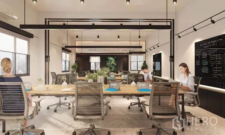 Office Space for rent in Khlong Toei, Bangkok - Modern office interior with shared desks, track lighting, black brainstorming walls, large windows, greenery, and contemporary task chairs.
