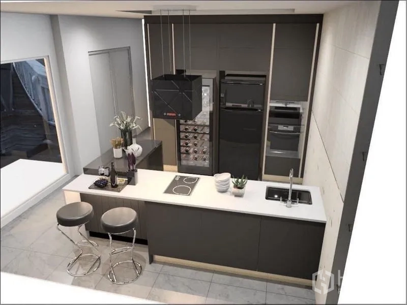 Detached House for sale in Suan Luang, Bangkok - Aerial view of modern kitchen showing breakfast bar, bar stools, wine fridge and built-in appliances.