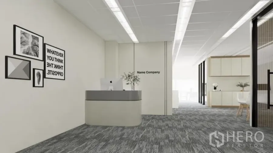 Office Space for rent in Dusit, Bangkok - Open-plan entrance with reception counter, wall art and corridor leading to pantry and work area.