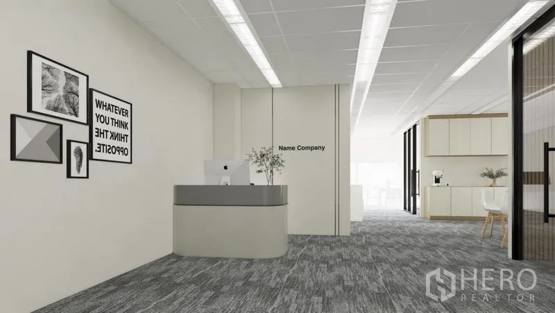 Office Space for rent in Dusit, Bangkok - Open-plan entrance with reception counter, wall art and corridor leading to pantry and work area.