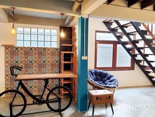 Detached House for rent in Pathum Wan, Bangkok - Creative corner featuring bicycle bar table, patterned tile wall and papasan chair