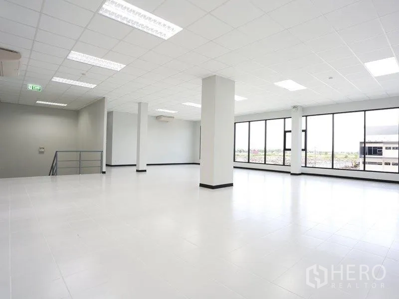 Factory for rent in Bang Pakong, Chachoengsao - Upper-floor office area with panoramic windows overlooking the industrial complex.